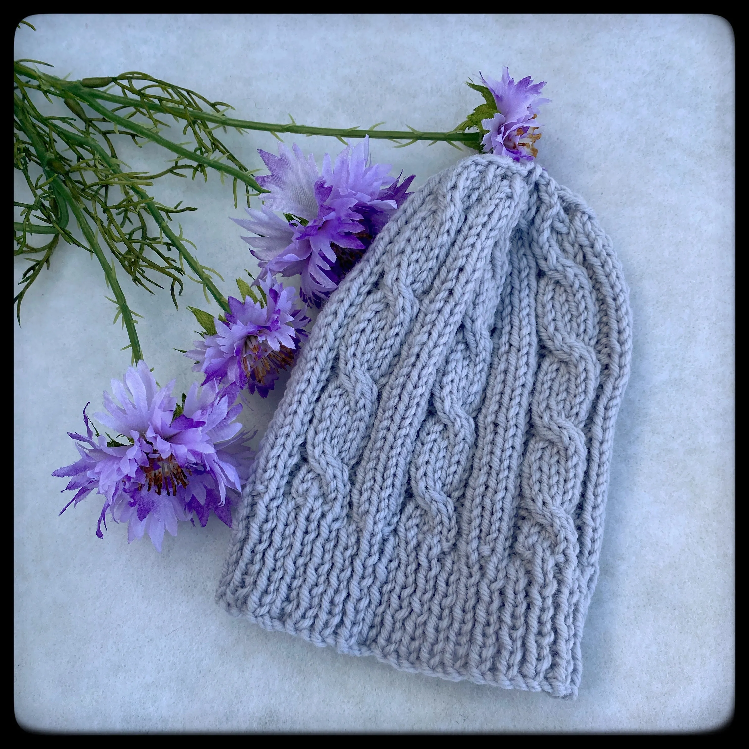 Cabled merino baby hat